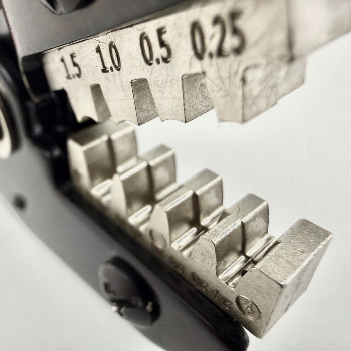 The Moto Iron® Ratcheting Crimp Tool, shown on a white background, features adjustable jaws and a red and blue design—ideal for electrical work and Harley-Davidson wiring.