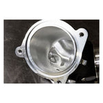A S&S Cycle Premium 55mm CNC Ported Black Manifold throttle body on a black surface.