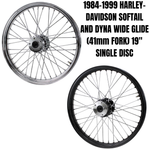 The Moto Iron® 19” × 2.15” Front Wheel for 1984-1999 Harley-Davidson Big Twin, featuring chrome spokes and a central hub, is shown side view on a white background.
