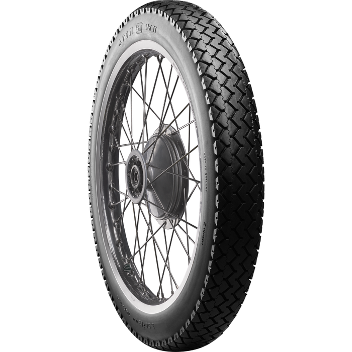 A classic block pattern tire, the Avon Tire - Safety Mileage Mark II AM7 - Rear - 4.00-18 - 64S by Avon, mounted on a spoked wheel.