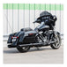 A black GNX SLIP-ONS for M8 TOURING MODELS - Black motorcycle parked in front of a building. Brand Name: S&S Cycle