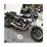 A purple and black motorcycle parked in front of a store, featuring the Sawicki Speed - Cannon 2 into 1 Pipe fits &