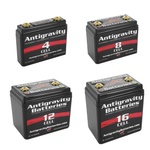Four black AntiGravity Small Case Lithium-Ion Batteries, labeled 4 Cell, 8 Cell, 12 Cell, and 16 Cell, are arranged in a grid against a white background, highlighting these lightweight motorcycle batteries.