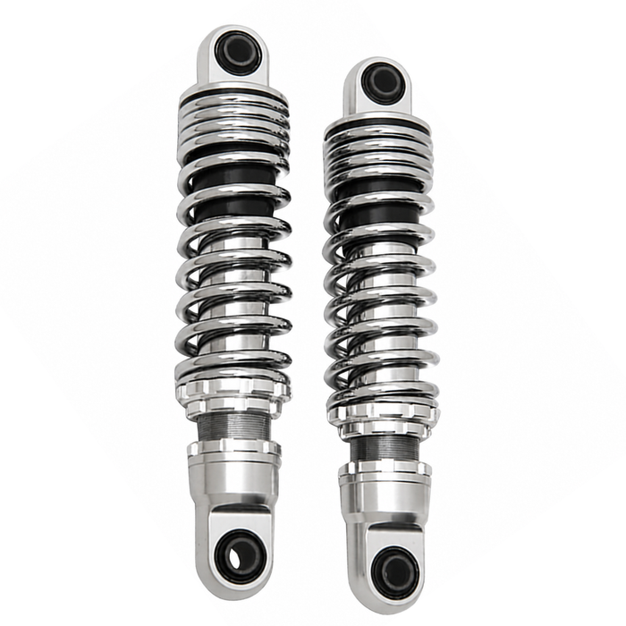 Two pairs of motorcycle shocks are shown: the top is Drag Specialties Premium Adjustable Height Shocks for 1980-2025 Harley-Davidson Touring in matte black; the bottom pair features chrome with black accents, ideal for Touring models.