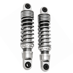 Two pairs of motorcycle shocks are shown: the top is Drag Specialties Premium Adjustable Height Shocks for 1980-2025 Harley-Davidson Touring in matte black; the bottom pair features chrome with black accents, ideal for Touring models.