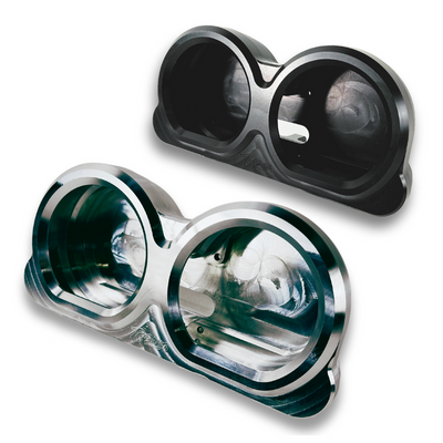 Placed side by side, two billet aluminum components from the TC Bros. Pro Series Gauge Relocation Bezel for Harley Davidson Road Glide feature circular cutouts; one boasts a dark color while the other has a shiny, reflective finish. These bezels from TC Bros. exemplify both style and precision.