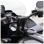 The TC Bros. Pro Series Handlebar Riser Adapter for 2015-2023 Harley-Davidson Road Glide, with a black and silver metal build, two cylindrical bases, and three mounting holes, is shown on a white background. Includes ignition lock retainer kit.