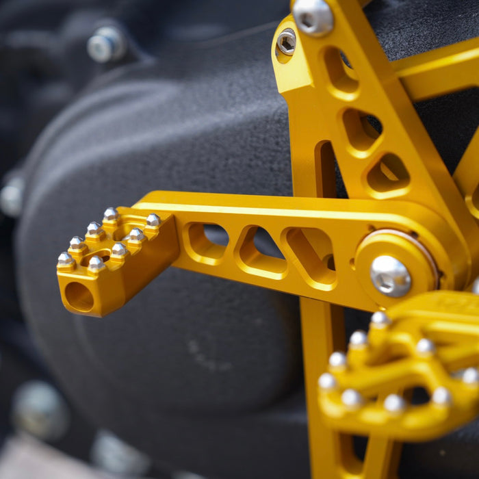 Honda cbr600rr with TC Bros. Pro Series Mid Controls, designed for maximum lean angle on the Harley Davidson Softail, are replaced by TC Bros. Pro Series Mid Controls fits 2018-newer M8 Softail Gold from the brand TC Bros.