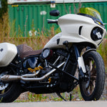 Two Trask Assault Charge High-Flow Air Cleaners for First Gen Harley-Davidson M8, each with an exposed red pleated filter and round metal housing—one in chrome and the other in sleek black.