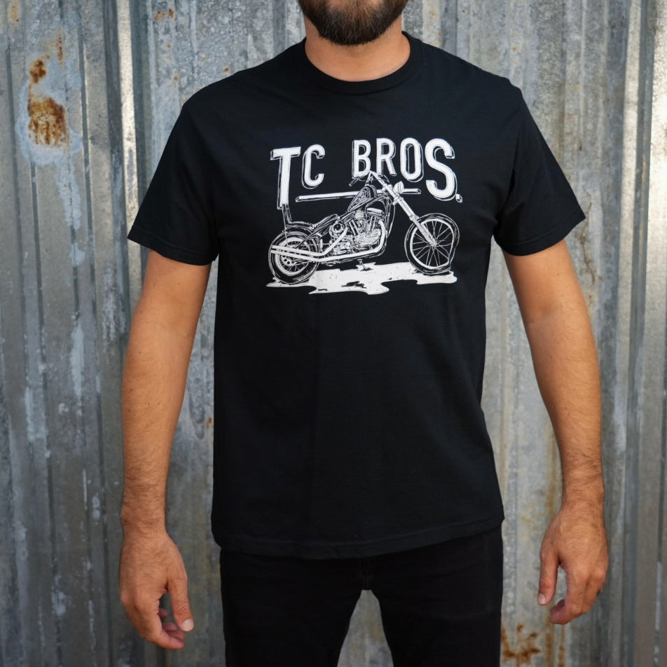 Graphic t-shirt design featuring a vintage motorcycle and the text &