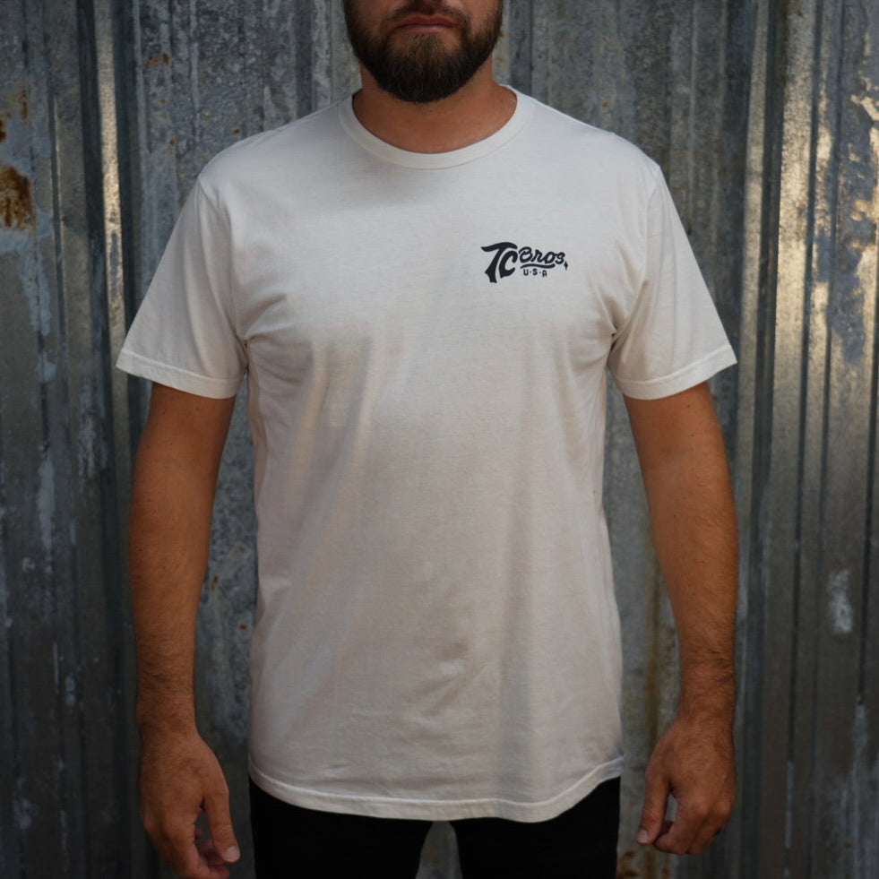 Script - White Tee from TC Bros. with black "70 years" text graphic printed on demand on the upper left chest area.