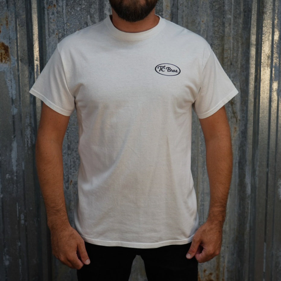 Staple plain white Pete - White Tee with a small "TC Bros." logo on the left chest area, made from 100% ring-spun cotton.