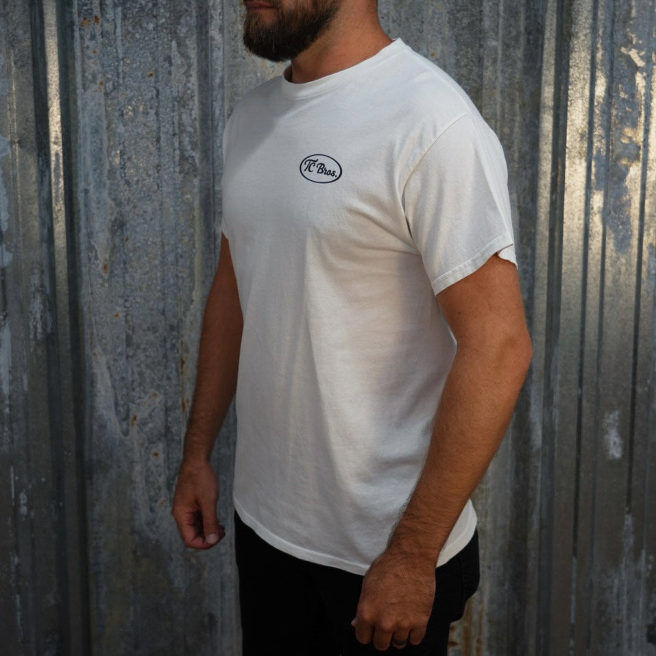 Staple plain white Pete - White Tee with a small "TC Bros." logo on the left chest area, made from 100% ring-spun cotton.