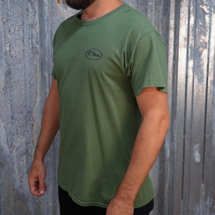 Plain olive green staple Pete - Military Green Tee with a small black logo on the left chest, printed on demand by TC Bros.