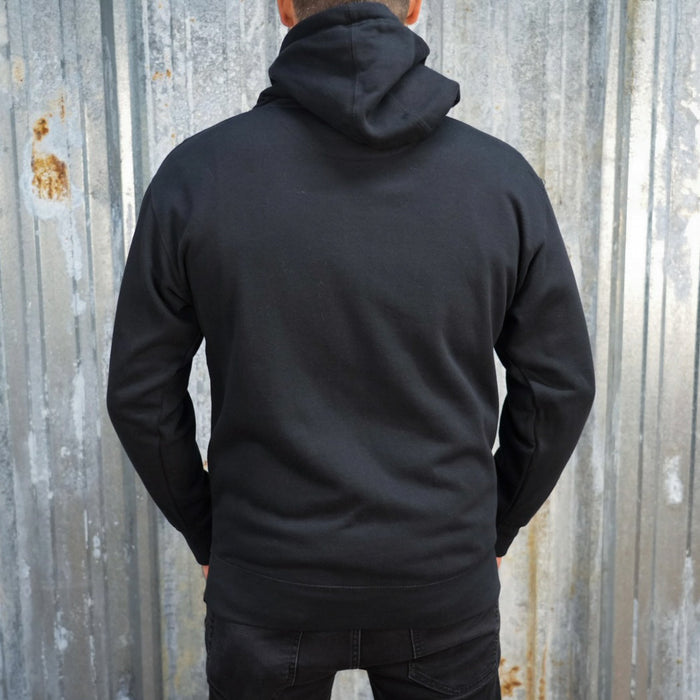 Badge Hoodie - Black/Orange, a classic streetwear piece, with a TC Bros logo embroidered on the left chest.