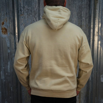 Beige Rider Hoodie - Sand featuring a red graphic of a motorcycle and text advertising TC Bros. custom motorcycle parts, printed on demand.