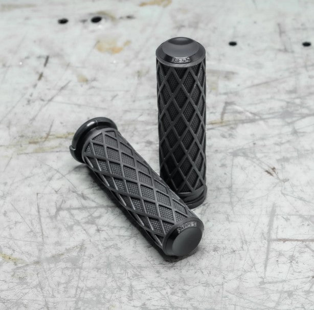 A pair of black Arlen Ness Fusion Diamond Grips, Black - TBW on a table.