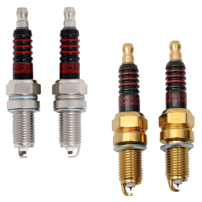 Two Drag Specialties Spark Plugs for Harley-Davidson Twin Cam and Sportster Evolution with gold-colored metal bases and black insulators with red rings.
