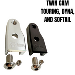 The TC Bros. Pro Series Easy Shift Lever Extension for Harley-Davidson Big Twin—Twin Cam includes silver and black metal brackets with threaded holes, engraved logos, and screws. Fits Touring, Dyna, and Softail models.