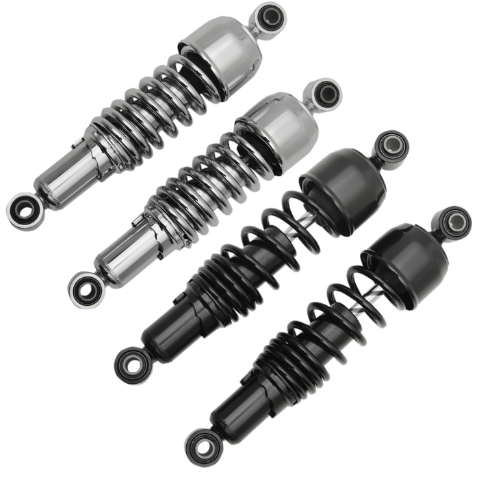 Four Drag Specialties Replacement Shocks for 1957-2017 Harley-Davidson motorcycles—two chrome, two black—are arranged parallelly on a white background.