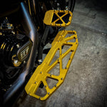 Three TC Bros. Pro Series MX Brake Pedal Pads for 1984-Up Harley-Davidson Touring in silver, black, and gold, each with a bolt-studded X-pattern—ideal for upgrading your Harley Bagger brake pedal pad.