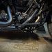 Three TC Bros. Pro Series MX Floorboards for Harley Davidson Bagger Touring Models with metallic finishes in silver, black, and gold featuring triangular cutout designs.