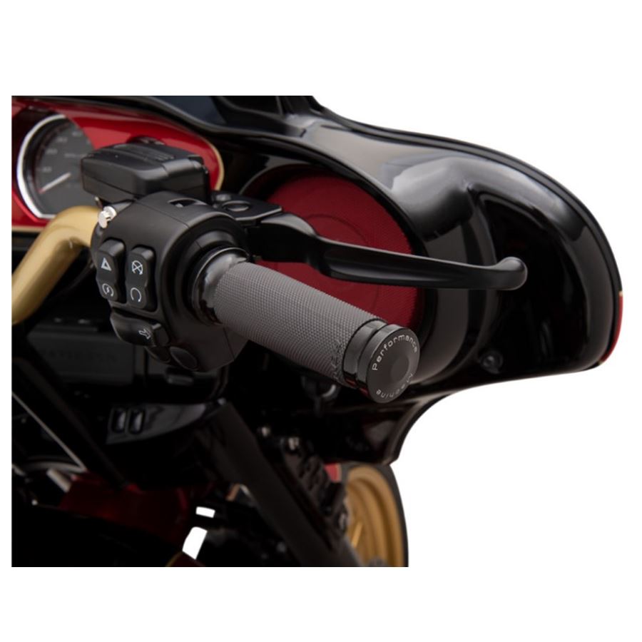 A close up of a handlebar on a motorcycle with Performance Machine Contour Grips For Harley - TBW Renthal Wrapped.
