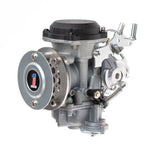 A close-up of a motorcycle engine showcases a Sportster points cover with a red and black emblem. Shiny chrome parts reflect light, highlighting Pangor Cycles' Cheap Sucker Bird Catcher/Air Cleaner for Harley-Davidson Carburetors, against a blurred background for sleek focus.