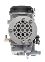 A close-up of a motorcycle engine showcases a Sportster points cover with a red and black emblem. Shiny chrome parts reflect light, highlighting Pangor Cycles' Cheap Sucker Bird Catcher/Air Cleaner for Harley-Davidson Carburetors, against a blurred background for sleek focus.