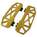 Three TC Bros. Pro Series MX Floorboards for Harley Davidson Bagger Touring Models with metallic finishes in silver, black, and gold featuring triangular cutout designs.