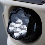 The Shark Demon™ 2 Performance LED Headlight Kit by Custom Dynamics is a round, black, DOT compliant headlight with an attached wiring harness and connectors. It also includes a separate mounting bracket with screws and rubber grommets, making it perfect for those seeking a reliable upgrade for their '22-'24 Harley Low Rider ST.