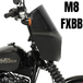 A black 2018-2026 Harley-Davidson Street Bob with a Memphis Shades Road Warrior Fairing in matte black; "M8 FXBB" is boldly displayed on the right.