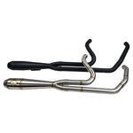 Close-up of a Harley Davidson M8 Softail highlighting the rear wheel, brake disc, and an SP Concepts Mid Length Elsinore Exhaust with a sleek metallic finish and logo.