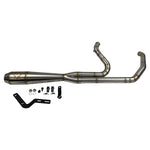 A sleek black Harley Davidson M8 Softail with an SP Concepts Works Edition Mid Length Elsinore Exhaust gleams under the sun on a concrete surface. Featuring saddlebags and a distinctive logo, this motorcycle exudes style and power.