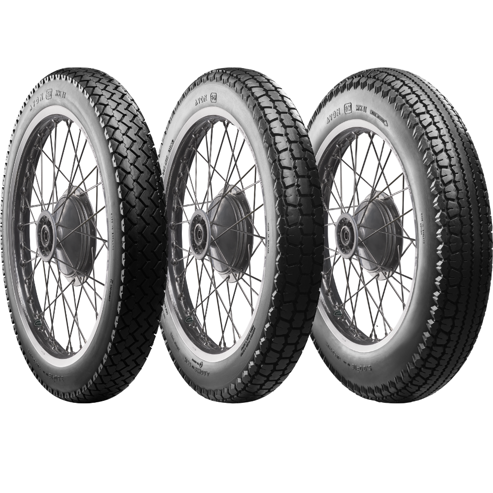 A classic block pattern tire, the Avon Tire - Safety Mileage Mark II AM7 - Rear - 4.00-18 - 64S by Avon, mounted on a spoked wheel.