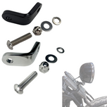 Two TC Bros. Springer Headlight Mounting Brackets with screws, washers, and nuts are shown on a white background. A partial view of a TC Bros. Springer Headlight Mounting Bracket and a motorcycle handlebar mirror appear in the lower right corner.