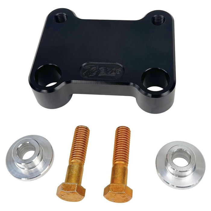 The TC Bros. Pro Series Riser Adapter for 2006-2023 Harley Davidson Street Glide features a black metal bracket with two threaded holes, silver washers, and gold bolts—shown on a white background. Perfect for performance upgrades.
