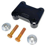 The TC Bros. Pro Series Riser Adapter for 2006-2023 Harley Davidson Street Glide features a black metal bracket with two threaded holes, silver washers, and gold bolts—shown on a white background. Perfect for performance upgrades.