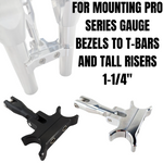 Two TC Bros. Gauge Relocation Brackets for 1-1/4" risers or tall T-bars on Harley-Davidson motorcycles, shown in black and silver, are designed to mount Pro Series gauge bezels. Brand: TC Bros.