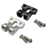Two TC Bros. Pro Series metal motorcycle chain adjuster blocks, one silver and one black, with matching screws, are displayed on a white background, exemplifying American craftsmanship.