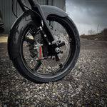 The TC Bros. Pro Series Radial Caliper Brake Line Kit for 2014-2023 Harley-Davidson Touring includes bolts, washers, connectors, and black/silver brackets from TC Bros., arranged on a white background.