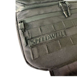 Introducing the Speedwell Cutaway Saddlebags for Harley Sportsters, M8 Softail, and Dyna—an elegant black saddlebag featuring dual compartments with stitched detailing and handles on each side. Expertly designed to straddle over the back of a motorcycle seat, it&