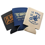 Set of three TC Bros. Can Koozies in black, navy, and beige, each with unique designs inspired by custom motorcycle parts.