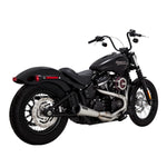 A black motorcycle with a Vance & Hines Stainless Steel 2-into-1 Upsweep M8 soft tail exhaust on a white background.