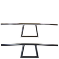 Two TC Bros. 1" Window Handlebars, one chrome and one black, featuring a distinctive rectangular center design inspired by TC Bros. Harley-Davidson styles, are displayed on a white background.