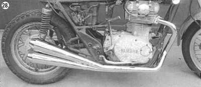 A black and white photo of an old motorcycle with an XS650 Ascot Exhaust System - 1978-1984 Specials by XS-Performance.