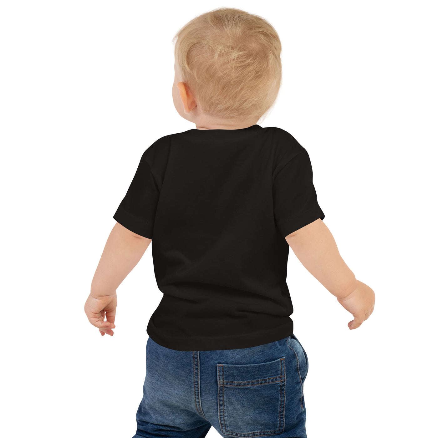 Toddler in a TC Bros. baby short sleeve tee with winged wheel logo and blue jeans standing against a white background.