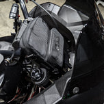 A TC Bros. Motorcycle Handlebar Bag attached to a motorcycle, for carrying riding essentials.