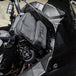 A TC Bros. Motorcycle Handlebar Bag attached to a motorcycle, for carrying riding essentials.