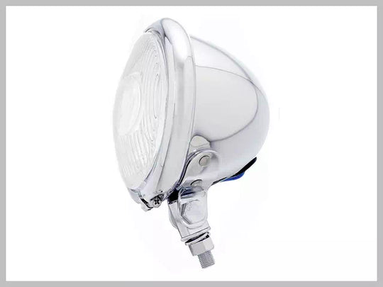 The 4.5" Vintage Chopper Style Headlight from Drag Specialties boasts a round, chrome-finished design with exposed blue, yellow, and black wires.